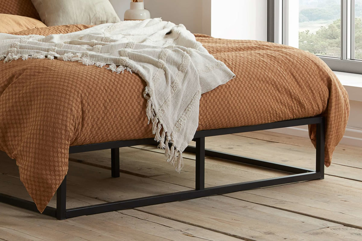 Bed on store metal frame