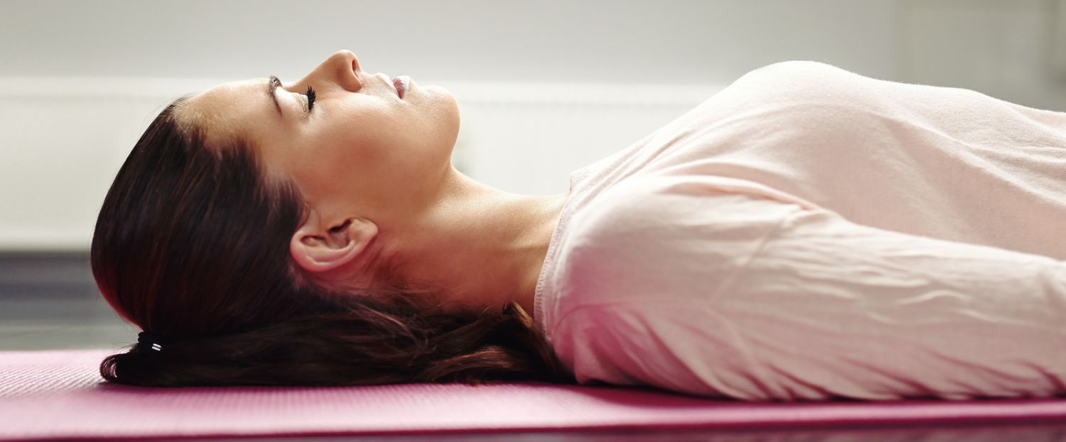 woman meditating to help her get to sleep