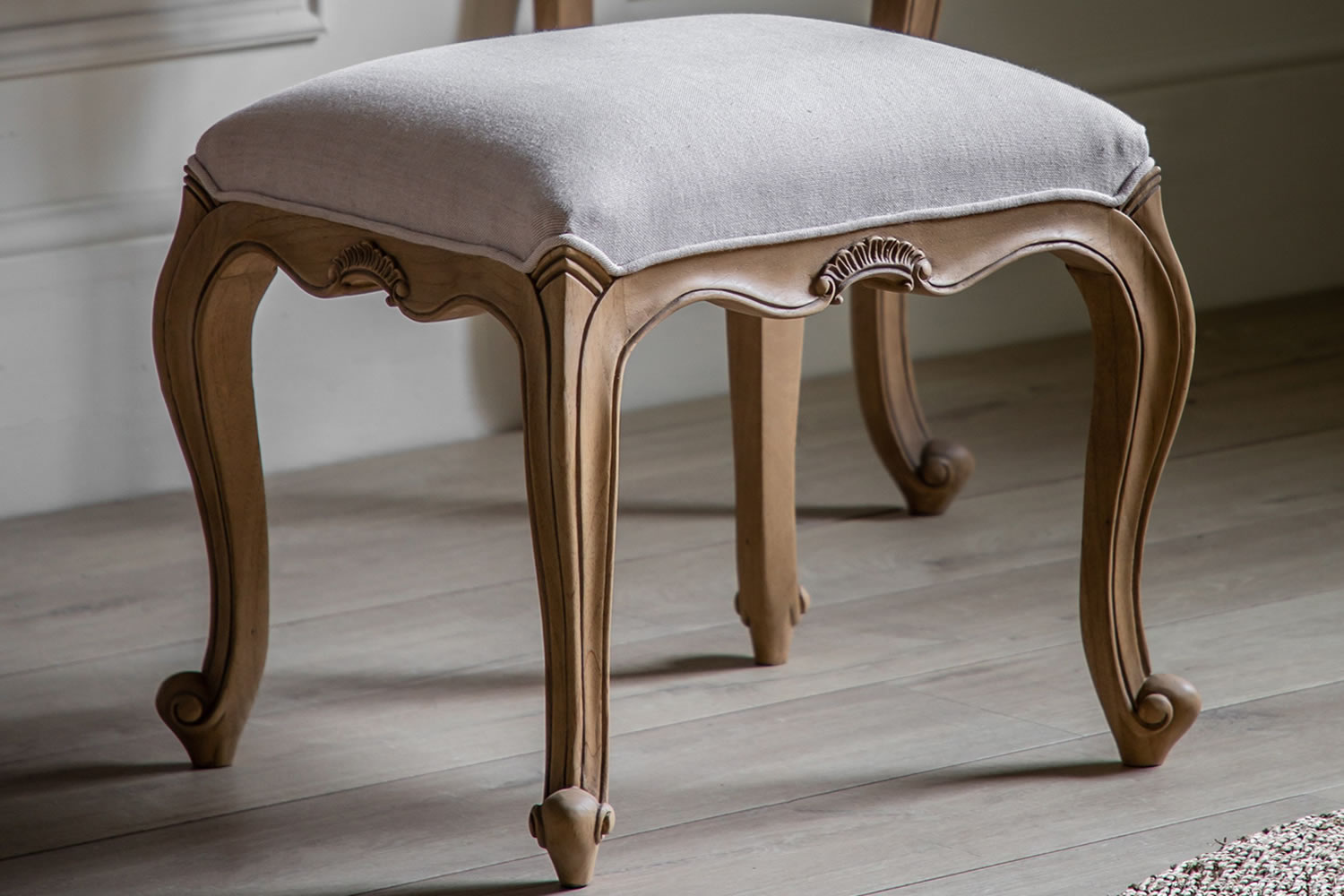 View Chic Bedroom Dressing Table Stool Crafted From Mindi Wood Elegant Weathered Finish Deeply Padded Seat Natural Linen Fabric French Inspired information