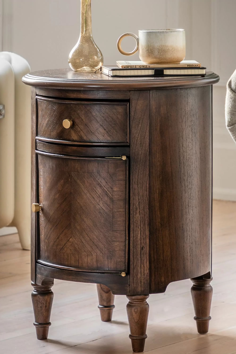 View Madison Wooden Drum Side Table Crafted From Mindi Mindi Veneer MDF 1 Door Cupboard 1 Storage Drawer Elegant Spindle Turned Legs information