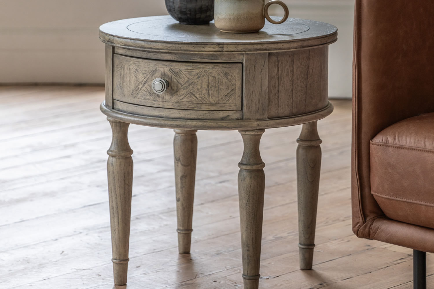 View Mustique Round 1 Drawer Side Table Crafted From Mindi Ash MDF Veneer ParquetStyle Robust Tabletop Metal Handle Spindle Turned Legs information